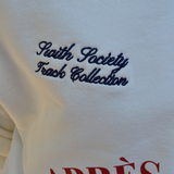 Closeup of swith apres run club relaxed hoodie with detail embroidery of swith society track collection