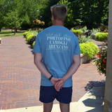 Athletic man wearing swith bocce club crewneck tee in light blue and standing in a garden setting